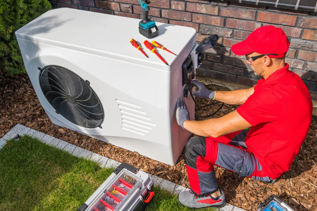 hvac technician working on air conditioner